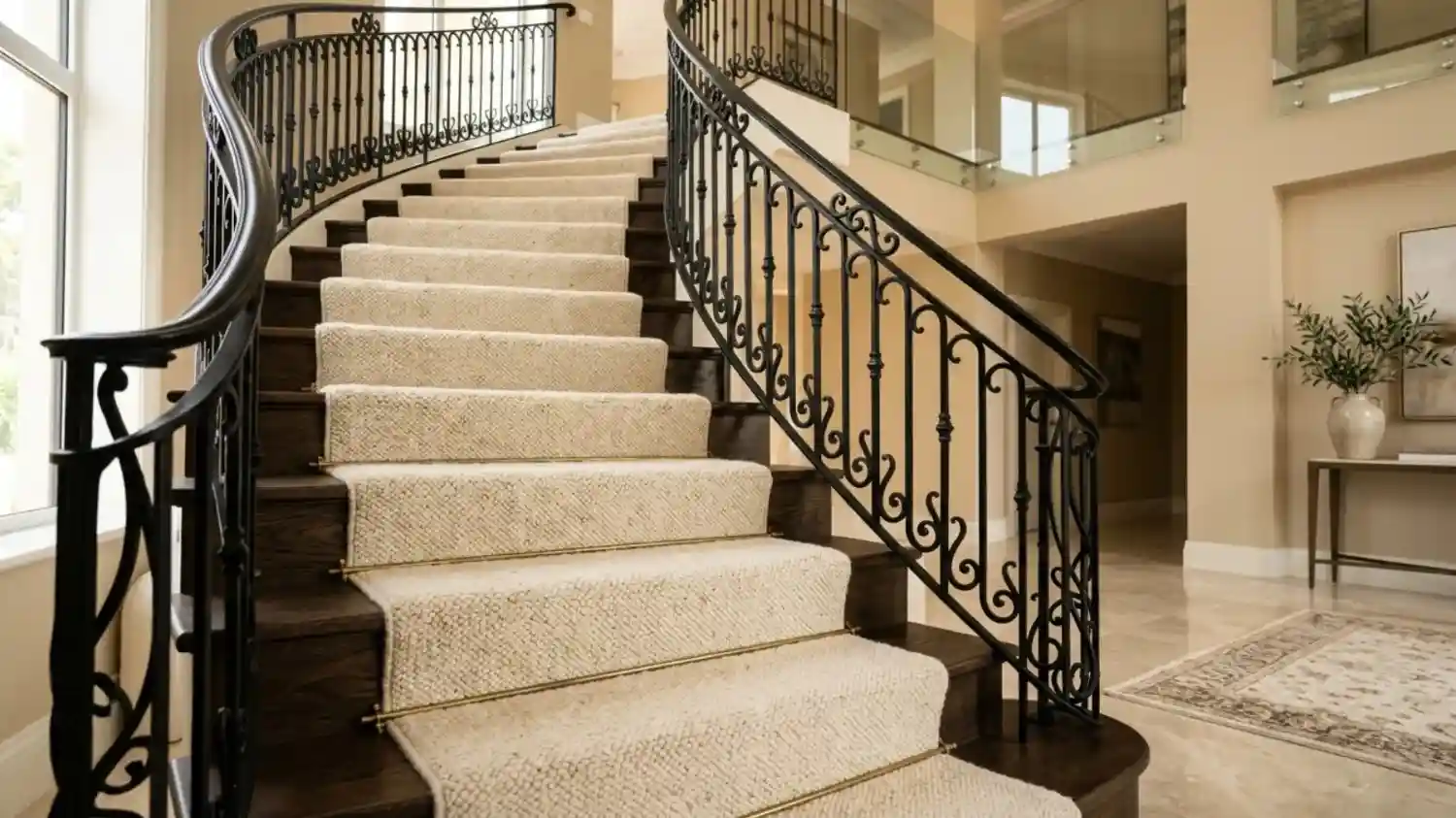 Carpet runner on curved wooden staircase in dubai.