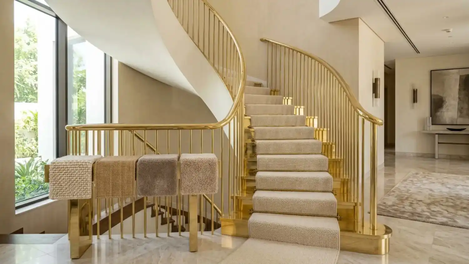 Carpet runner and samples on gold staircase in dubai.